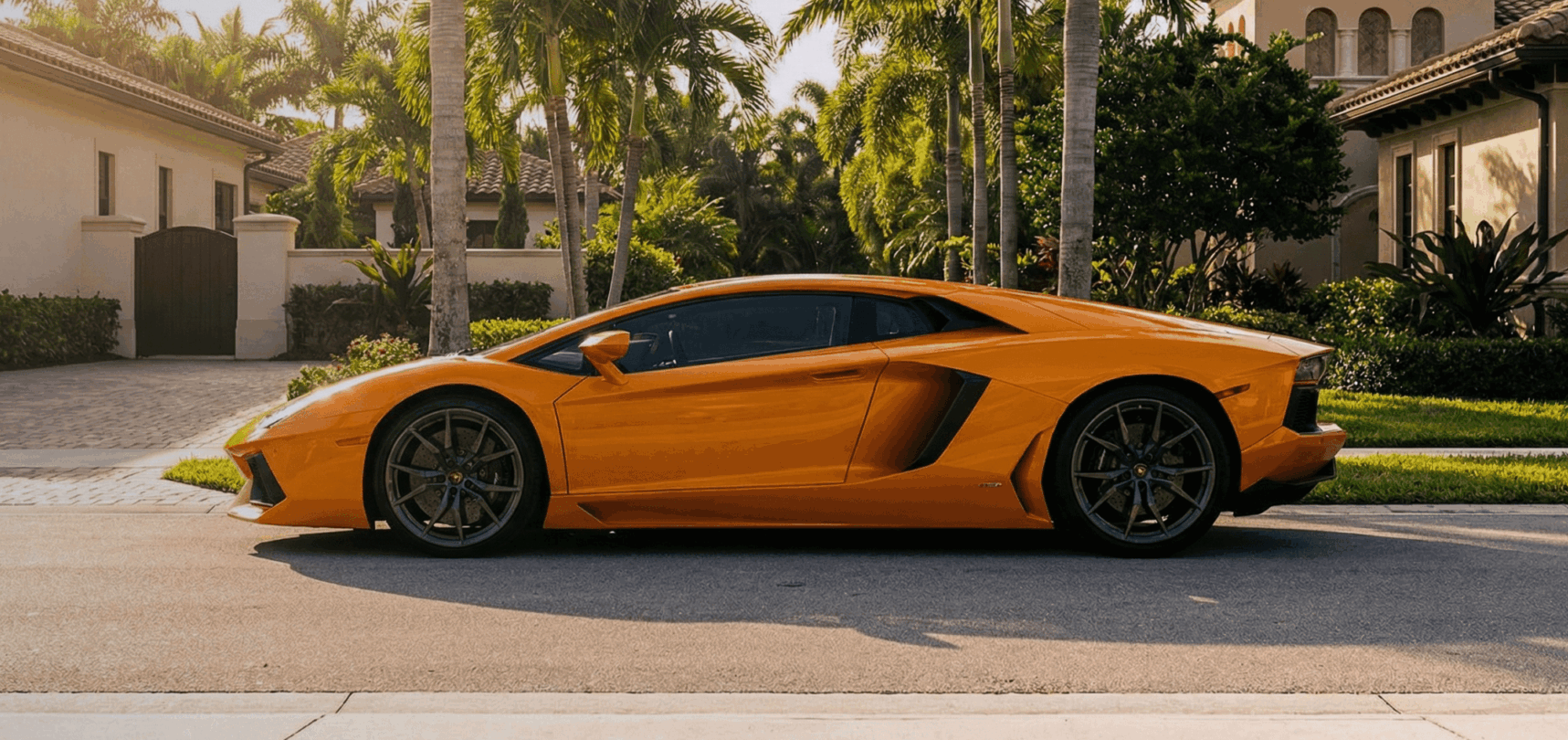 An orange sports car parked in front of a house
