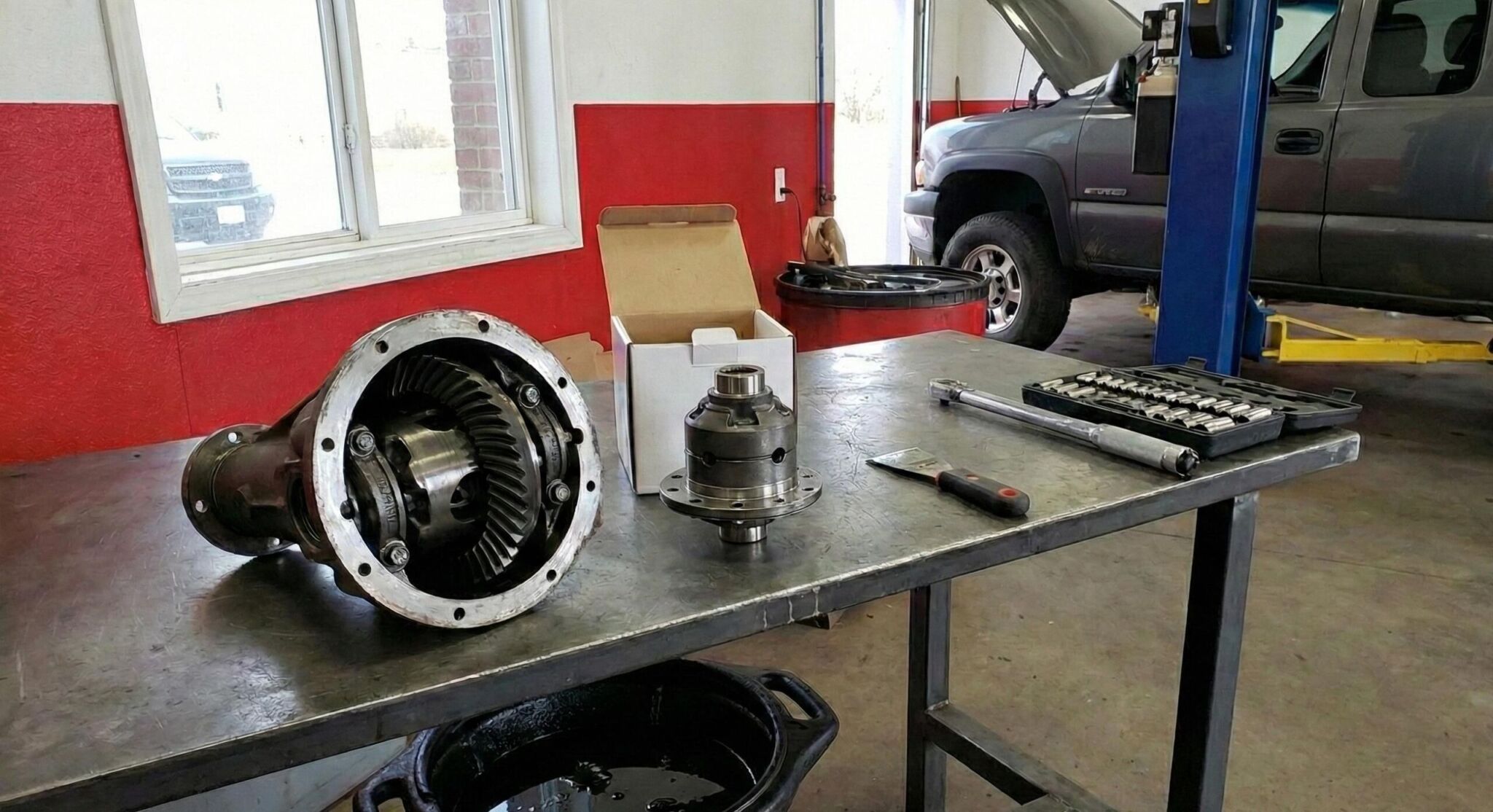 A workbench with a fan and tools on it
