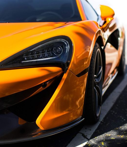 A close up of the front of a McLaren sports car